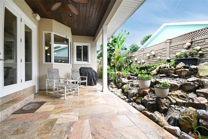 Lanai with massive stone waterfall professionally installed.