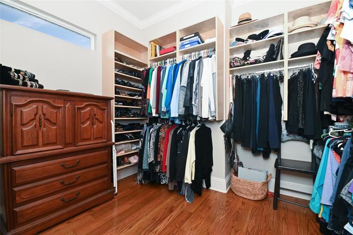 Huge Walk-in Closet with custom shelving.