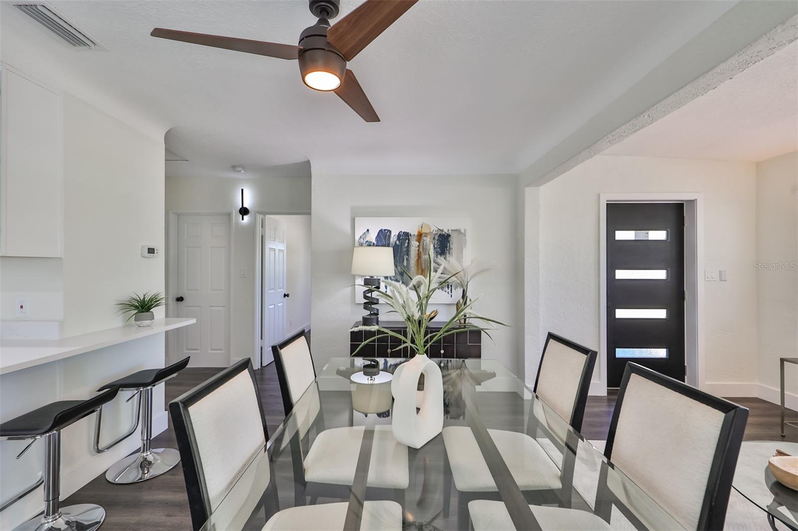 Dining room with hallway view to guest bedrooms and bathroom
