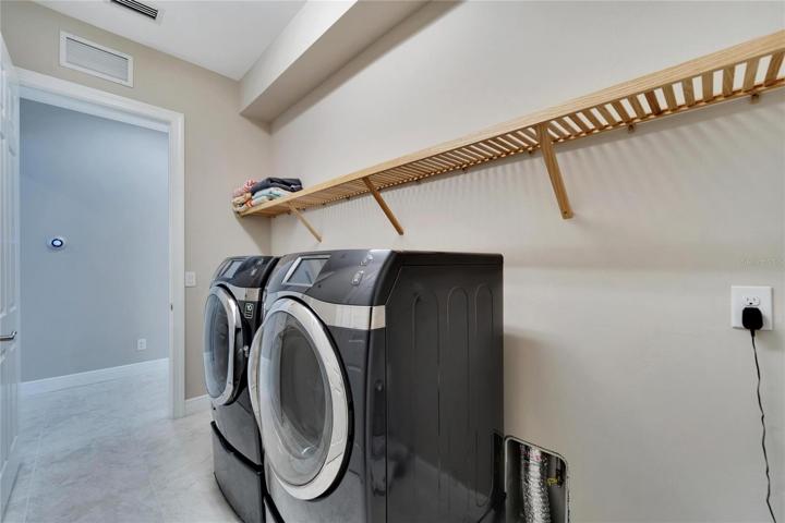 Laundry room next to the garage