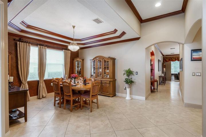 view of foyer that leads to rear of home. You'll find the owner's suite an the end of the foyer to the left and the family room to the right.