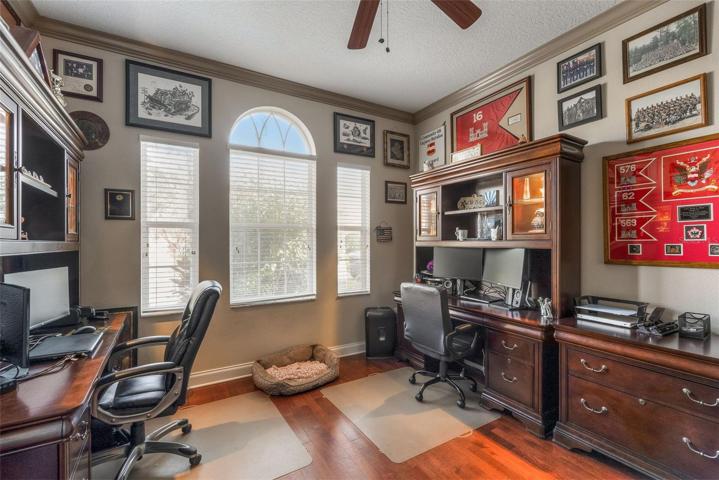 Dual door den (no closet) in the front of home near entry.