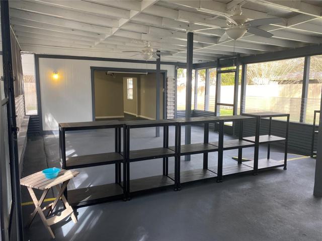 Huge porch w/temporary shelves/paint on concrete