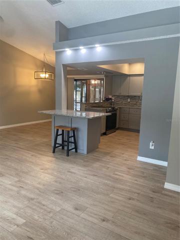 living room to open kitchen & dinette