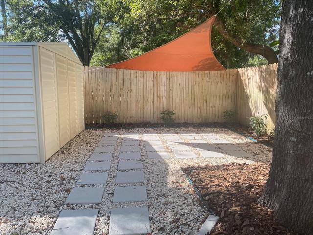 another patio area w/shade sail