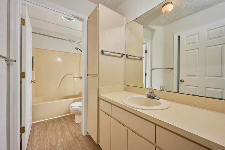 Guest bathroom offers separate vanity area