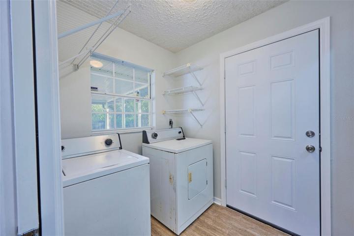 Indoor laundry room with side entrance