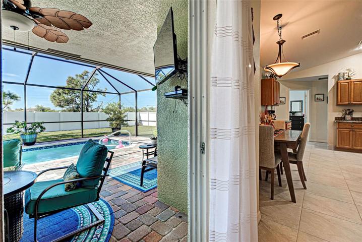 Nice large lanai. Notice the vinyl fencing and low maintenance yard.