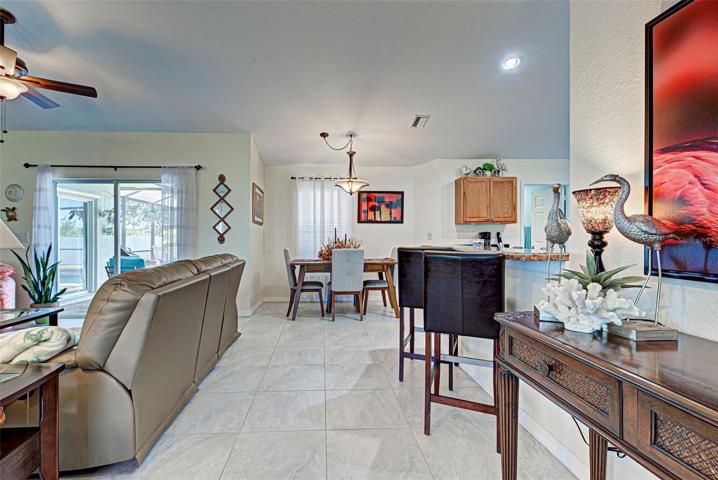 Dining adjacent to living room and kitchen