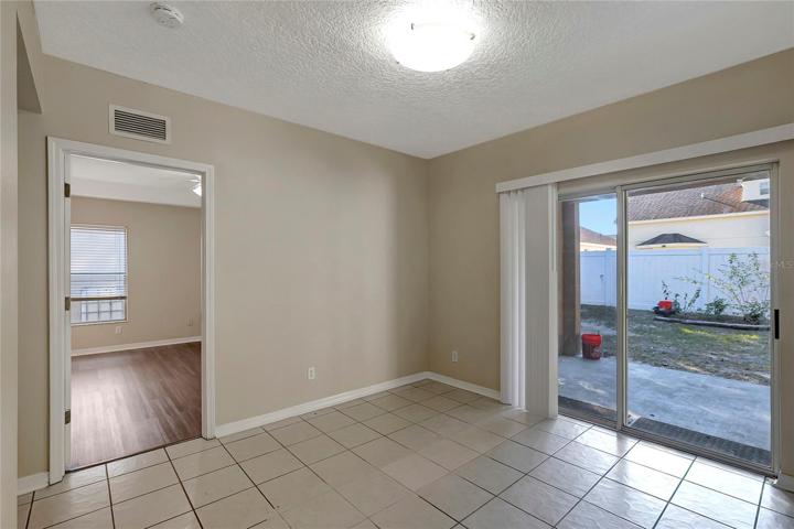 EAT IN AREA WITH SLIDING DOOR TO BACKYARD.