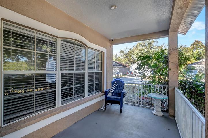 FRONT PORCH WITH RAILINGS.