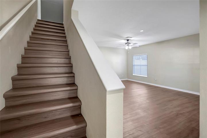 STAIRS TO SECONDARY BEDROOMS AND LOFT.