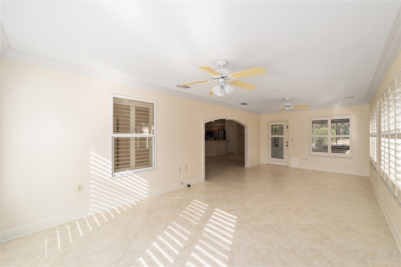Florida room with access to large covered patio and Spa