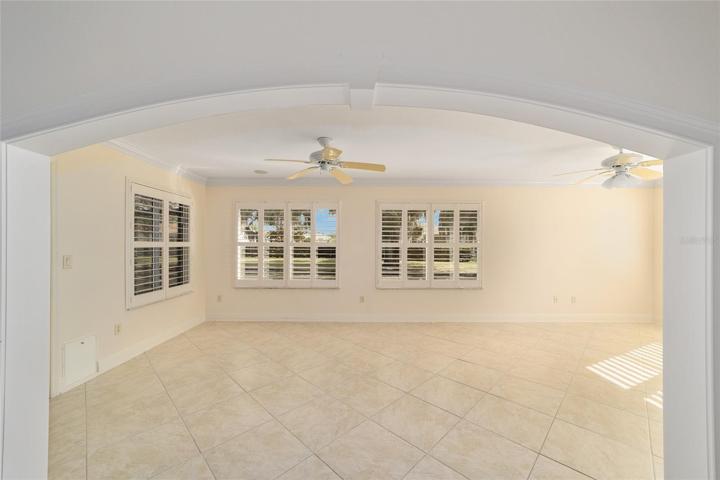 Enclosed Florida room with plantation sutters and AC