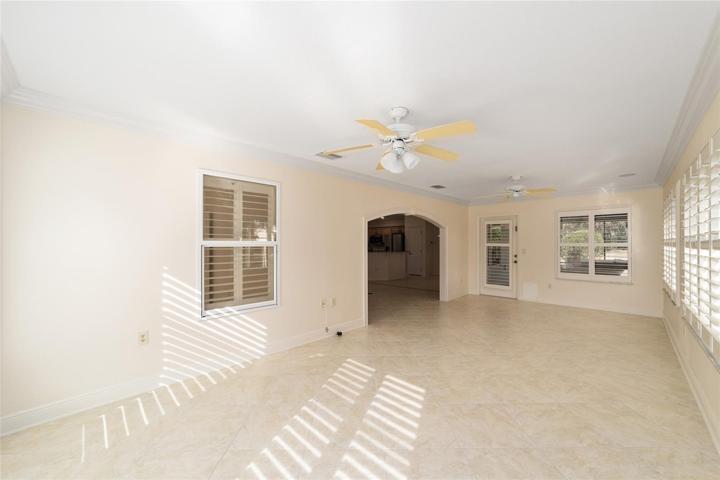 Florida room with access to large covered patio and Spa