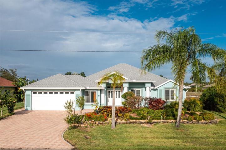Welcome home! Note the paver driveway and lovely landscaped and tiered front yard!
