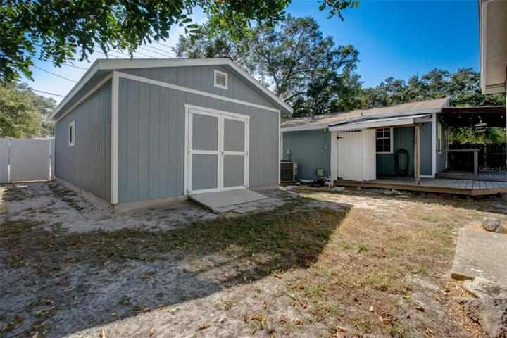 View of shed and back porch