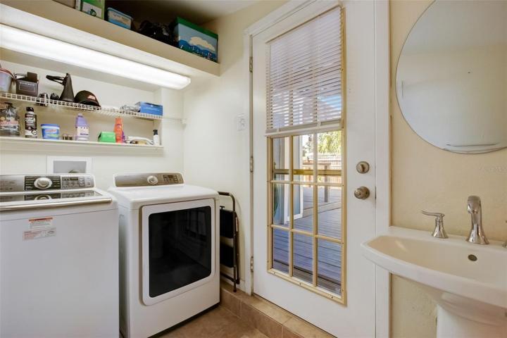 View of washer and dryer in half bathroom