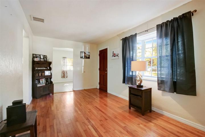 View of living room with doorway to bonus room