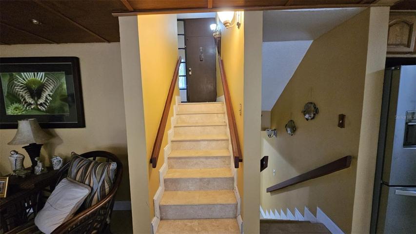 Stairs to the laundry room (upstairs) and to the bedrooms (downstairs)