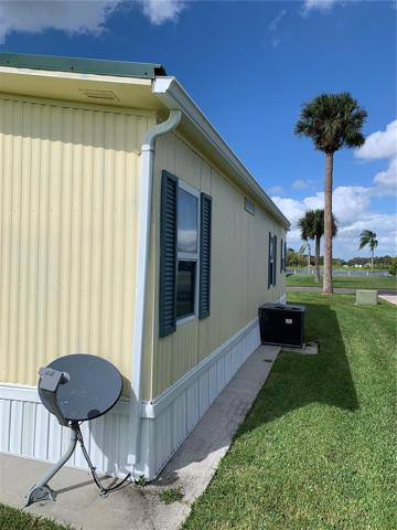 Back and side with the view of the lake across the street