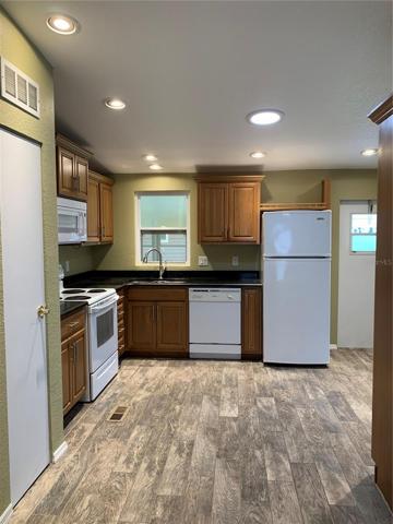 Kitchen with refrigerator and dishwasher