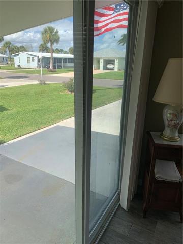 Door from the Florida room to the front of home