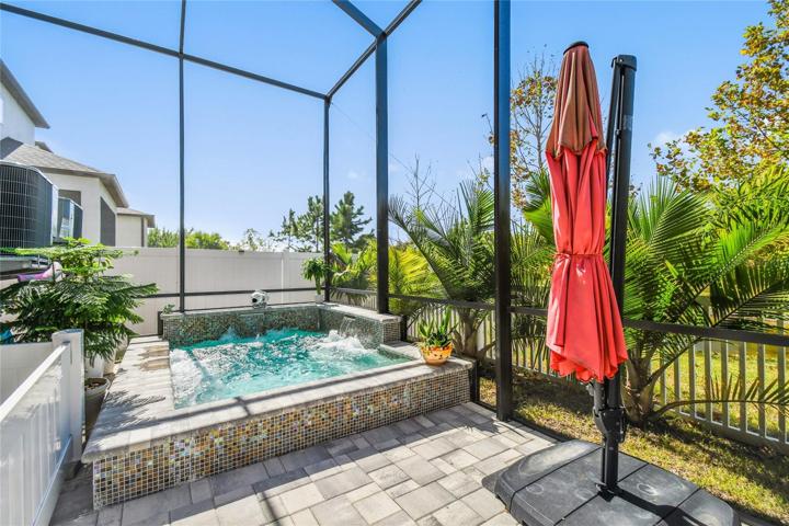 Spool spa/ cocktail pool/ heated/ led lighting/water fall/ built in seating and jets.