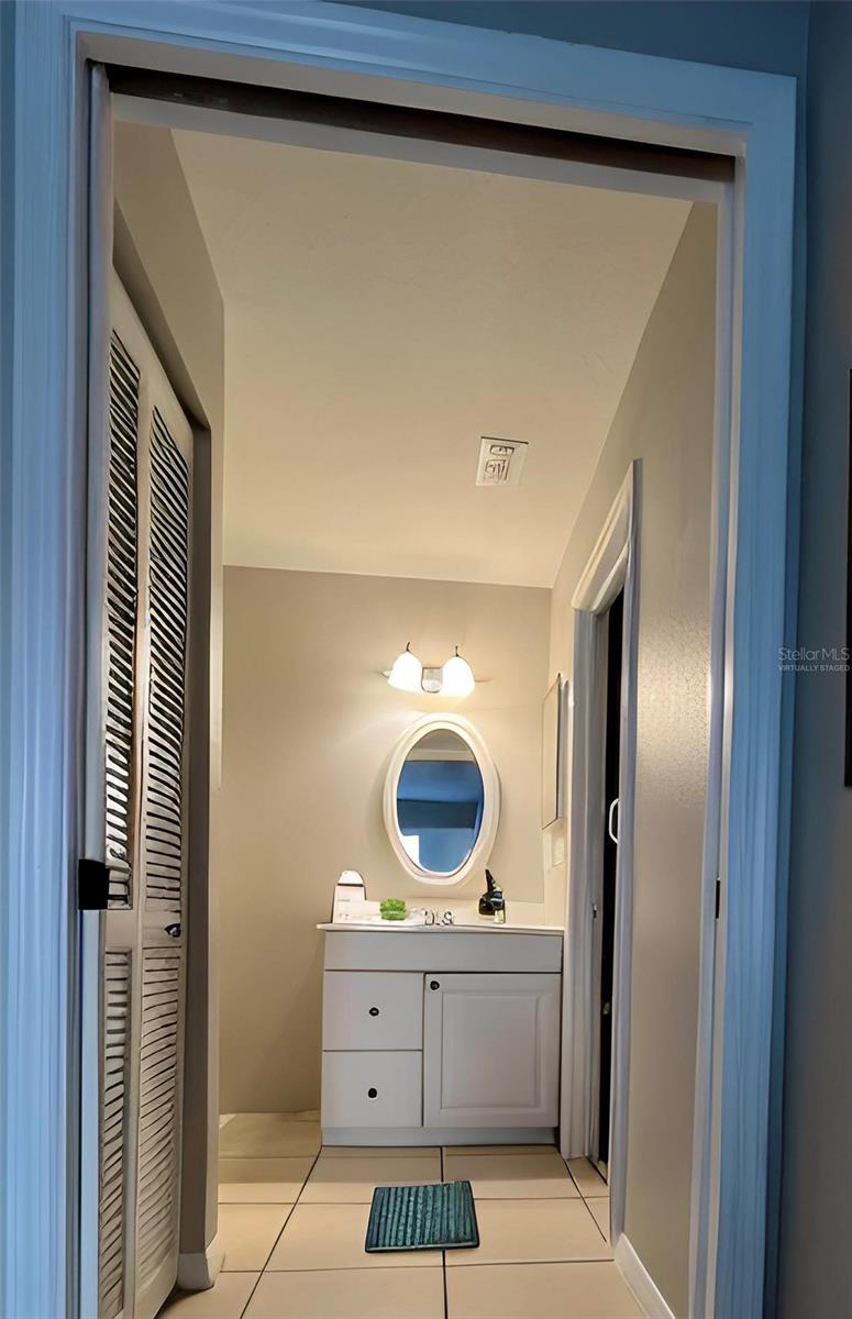 Owner's bathroom vanity area  (virtually staged)
