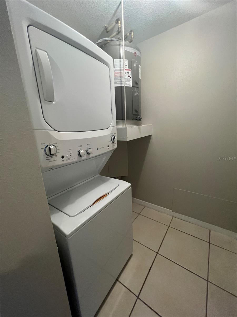 Laundry Room with brand new appliances and water heater.