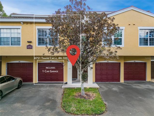 Front view of 4751 Travini Circle, unit #4-103. Includes a 1 car garage!