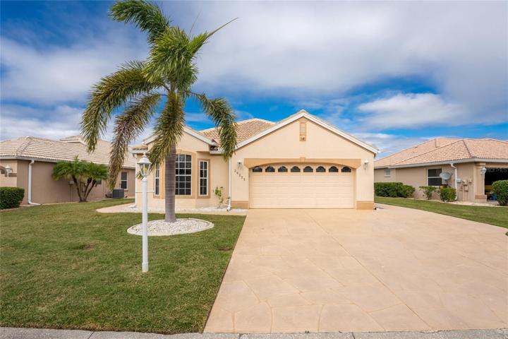 Front elevation, oversize stamped concrete driveway