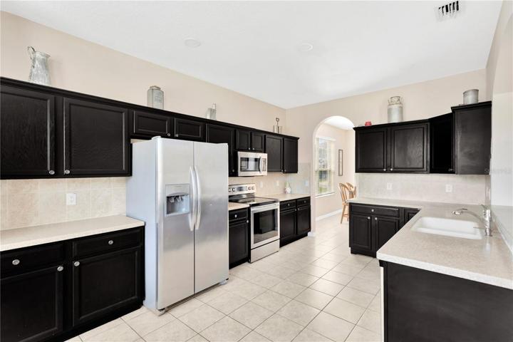 Large spacious kitchen with stainless steel appliances