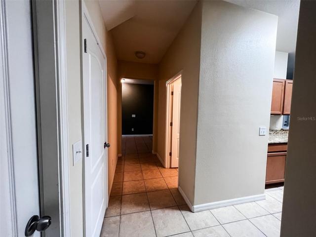 Downstairs hall to garage, closet, and 1/2 bath