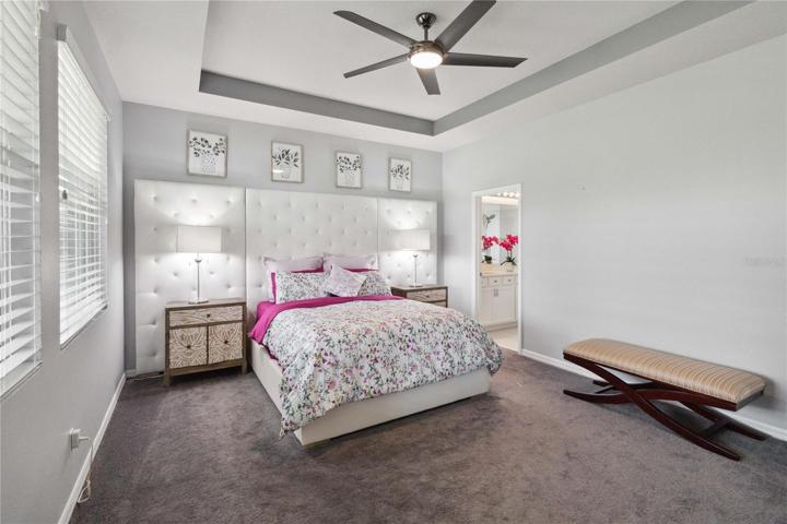 Master suite with large windows and a beautiful view