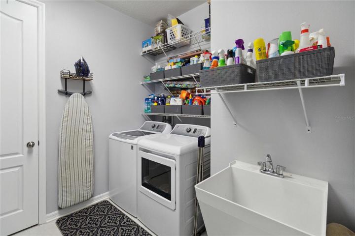 Large laundry room with built in sink