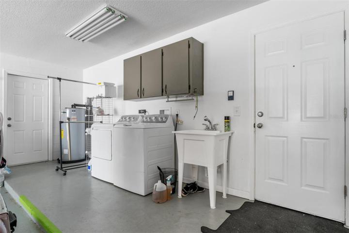 Washer/dryer hook ups located in 2 car garage.