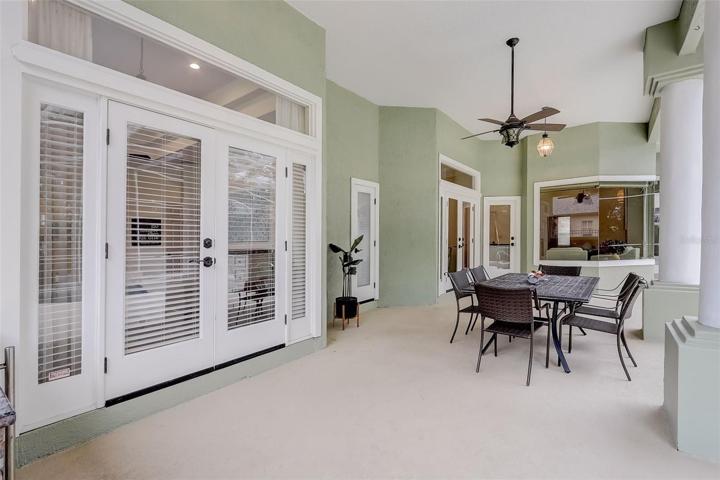 Travertine walkway leading to your double front doors