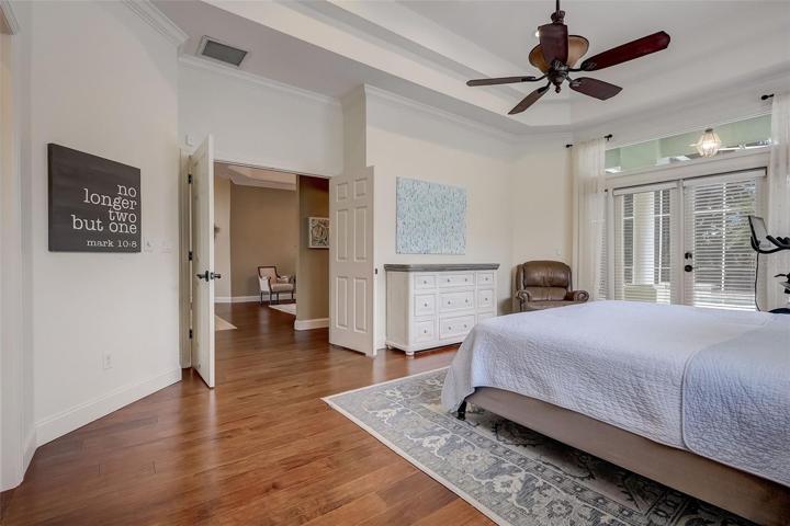 Huge & bright master suite with trey ceilings & private access French Doors to the lanai.
