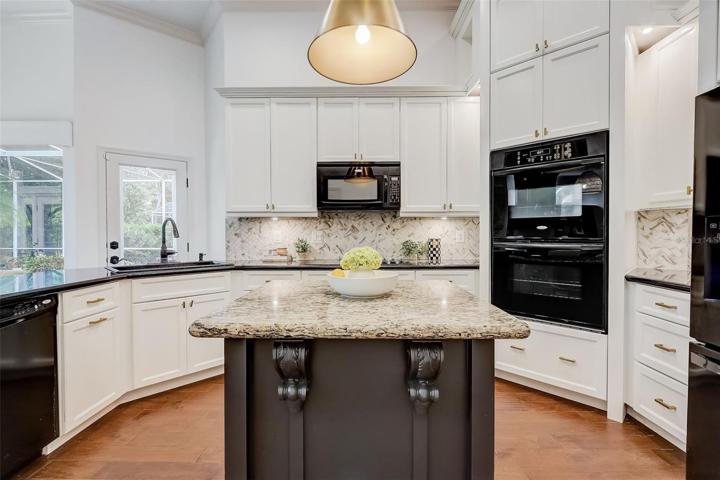 42" cabinets, modern appliances, granite countertops, under cabinet lighting, tile backsplash & more!