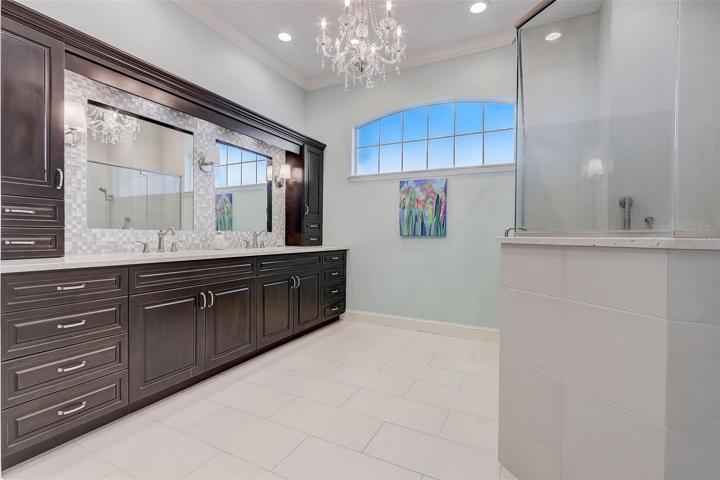Lovely master bath with plenty of cabinet space, dual sinks and large shower stall