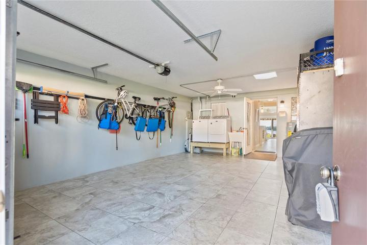 Tiled garage with lots of storage