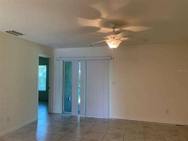 Living room with door to bedroom