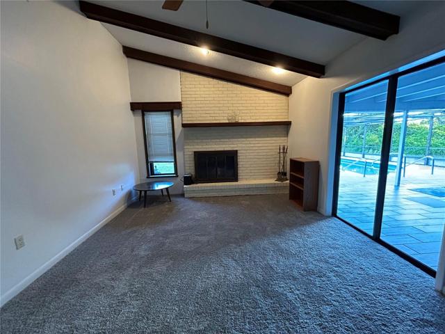 FAMILY ROOM WITH WOOD BURNING FIREPLACE