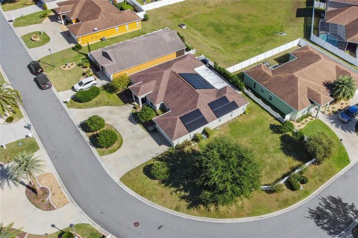 Home with view of Solar Panels on Oversized, Corner Lot from above.
