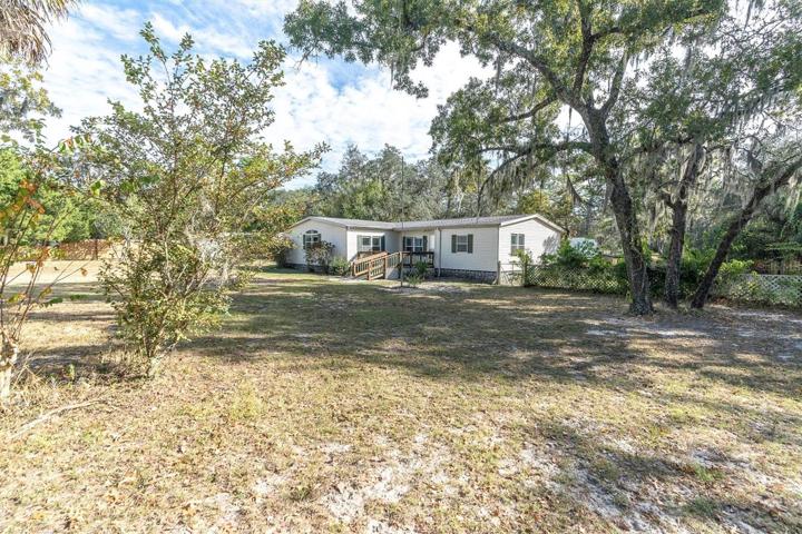 BEAUTIFUL PROPERTY WITH A 1995 TRIPLE WIDE