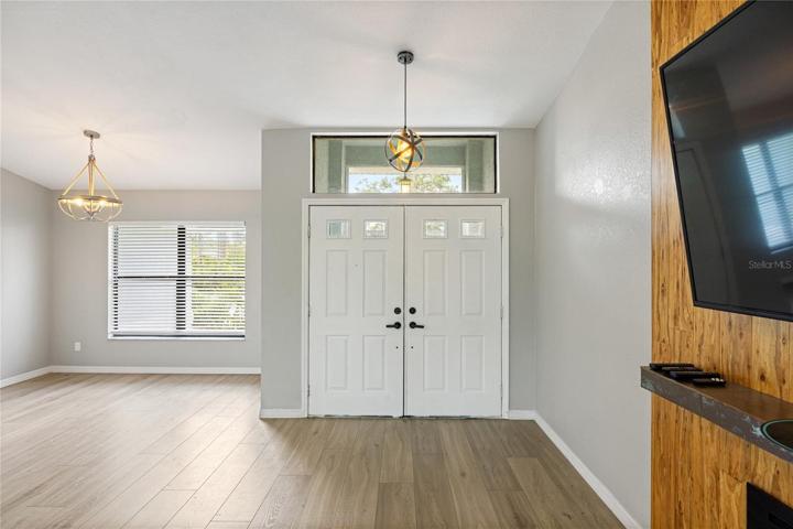 double door foyer and dining room