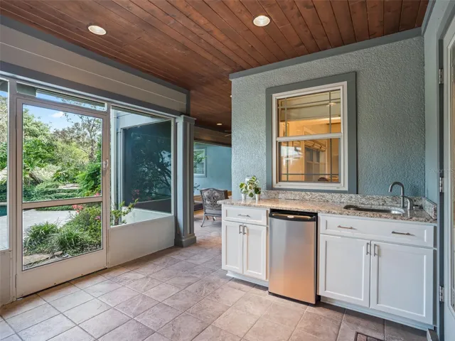 Outdoor Kitchenette and screened seating area
