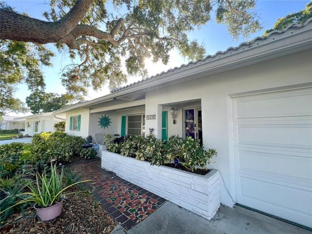 As you approach, you'll be greeted by stunning mature landscaping, featuring a majestic oak tree that adds to the home's allure. Step onto the inviting covered front porch, and you'll immediately sense the charm within.