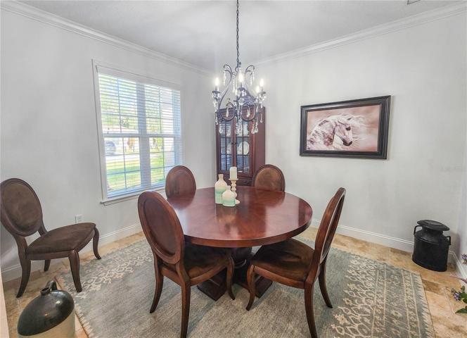 Formal dining area can also be used as an office or den